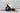 Woman practicing yoga on Shakti Warrior eco friendly 3mm cork chakra yoga mat