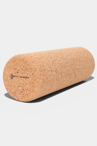 Cork yoga roller on a light gray background