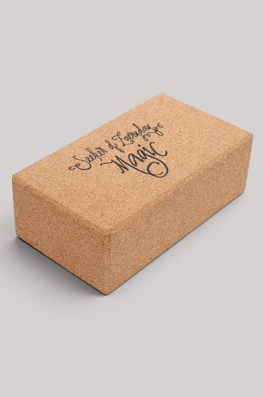 Cork yoga block with 'Seeker of Everyday Magic' text on a gray background