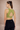 Woman wearing an adjustable green sports bra with high support
