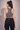 Back view of Shakti Warrior purple medium support BEAU sports bra