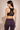 Back view of Shakti Warrior black high support ORA mesh sports bra