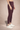 Shakti Warrior high waisted leggings in bugundy back view