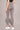 Woman wearing Shakti Warrior High-waist AumLux Leggings – Gray