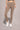 A woman wearing the High-waist AumLux Leggings in Brown