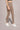 A woman wearing the High-waist AumLux Leggings in Brown