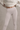 Light gray leggings with laser cut on a neutral background