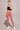 Woman wearing Shakti Warrior Rise Support Leggings - Dusty Rose