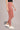 Woman wearing Shakti Warrior Rise Support Leggings in Dusty Rose