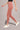 Woman wearing Shakti Warrior Rise Support Leggings in Dusty Rose