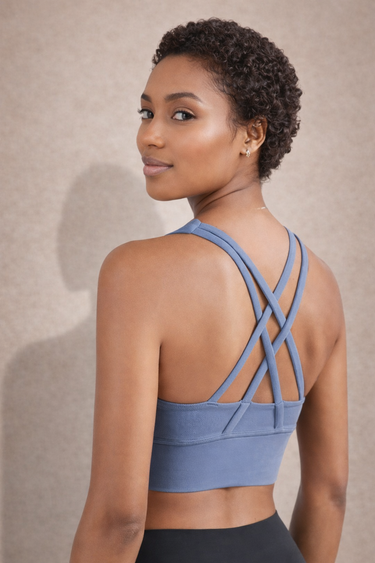 Side view of Shakti Warrior blue medium support RE sports bra
