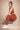 Woman wearing Shakti Warrior IVY medium support strawberry red yoga set