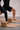 Person using Shakti Warrior tiger design yoga blocks during yoga practice