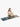 Woman practicing yoga on a marble blue yoga mat with a white background