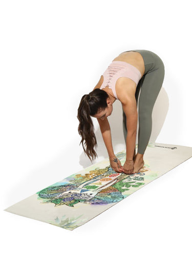 Woman practicing yoga on Shakti Warrior 6mm green elephant TPE yoga mat