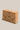 Cork yoga block with floral patterns on a beige background