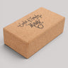 Cork yoga block with 'Seeker of Everyday Magic' text on a gray background