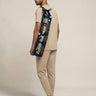 Man holding a yoga mat bag 