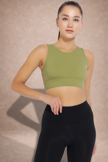 Woman wearing an adjustable green sports bra with high support