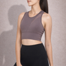 Woman wearing Shakti Warrior purple medium support BEAU sports bra
