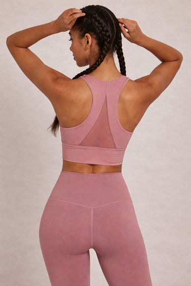 Back view of Shakti Warrior pink high support ORA sports bra