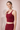 Woman wearing Shakti Warrior red medium support sports bra