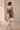 Woman carrying a shakti warrior yoga mat bag for her yoga mat