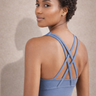 Side view of Shakti Warrior blue medium support RE sports bra