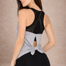 Side view of Shakti Warrior Motion Core gray performance tank