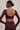 Woman wearing Shakti Warrior RE in burgundy cross back crop top