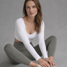 Woman wearing Shakti Warrior RE in white cross back crop top